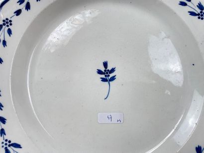 null Lot of four plates:

- TOURNAI, soup plate with twisted ribs and decoration...