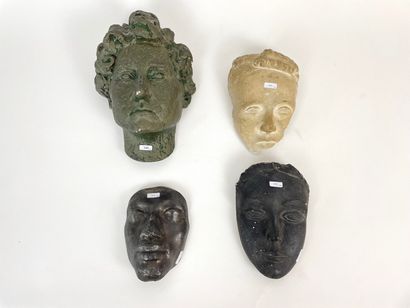 null "Faces of Women," mid-20th century, a grouping of four terracotta and/or plaster...