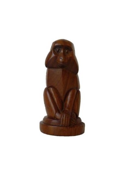 null "Babouin assis", XXe, sujet en bois fruitier sculpté, h. 17,5 cm.