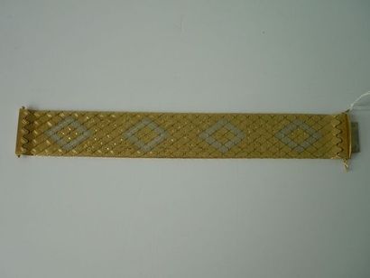 null Bracelet rigide en or jaune et blanc, +/- 79 g.
