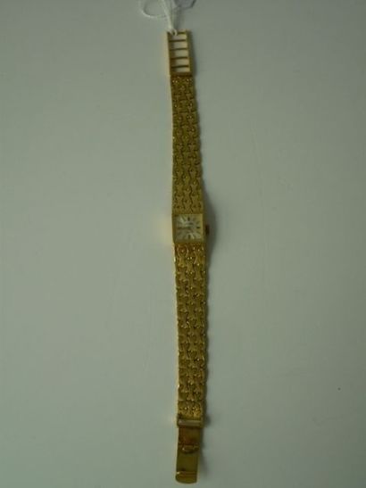 null Montre de dame en or jaune poinçonné - 750 - et agrémentée d'un bracelet semi-rigide,...