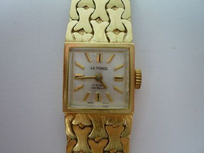 null Montre de dame en or jaune poinçonné - 750 - et agrémentée d'un bracelet semi-rigide,...