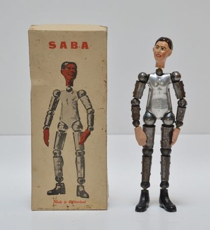 null SABA (fabrication suisse), personnage articulé en tôle, h. 20 cm [neuf en b...