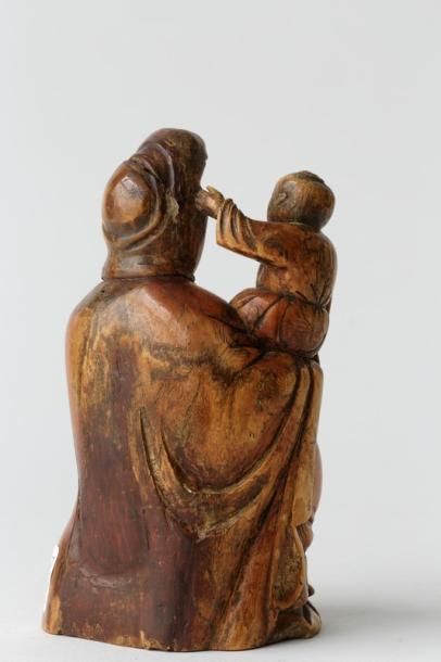 CHINE "Guanyin donneuse d'enfants", dynastie Ming / XVI-XVIIe, groupe en ivoire sculpté...