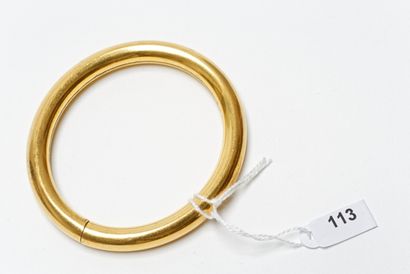 null Bracelet rigide dit esclave en métal doré.
