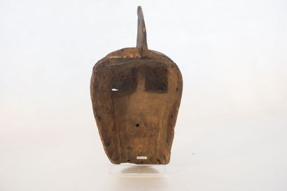 ART TRIBAL Masque à cimier, XXe, bois sculpté et polychromé, h. 38 cm.