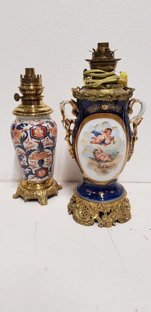 null 2 oil lamps, one consisting of a porcelain vase in the Imari taste (with an...