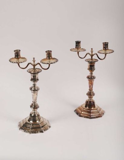 null Pair of silver-plated bronze candleholders with cut-off sides, the bobèches...