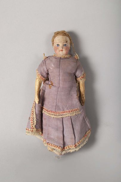 null Small doll with a head in biscuit and a body in composition. She is dressed...