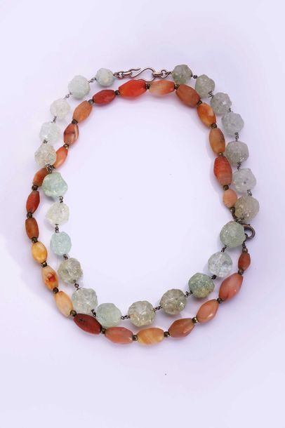 null Two necklaces of ancient pearls: one of polished agate pearls the other mixing...