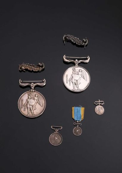 null -IDEM-. Two silver medals, without ribbons, with SEBASTOPOL clips. A reduction...