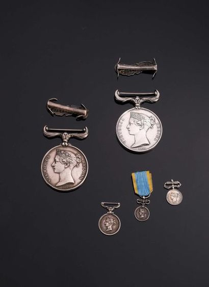 null -IDEM-. Two silver medals, without ribbons, with SEBASTOPOL clips. A reduction...