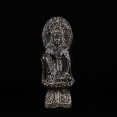 Statuette in grey stone, representing Guanyin...