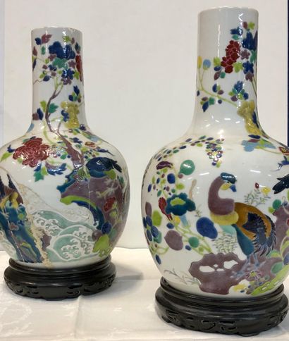 null A pair of Chinese porcelain vases with polychrome decoration

of birds in branches...