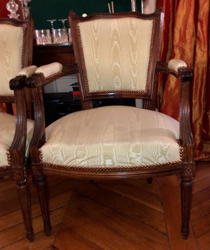 null Pair of armchairs with "Chapeau de gendarme" backs, fluted and tapered legs...