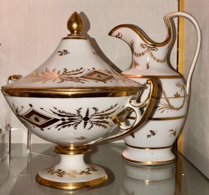 null Small white porcelain bouillon on a pedestal with gold decoration of rhombuses...