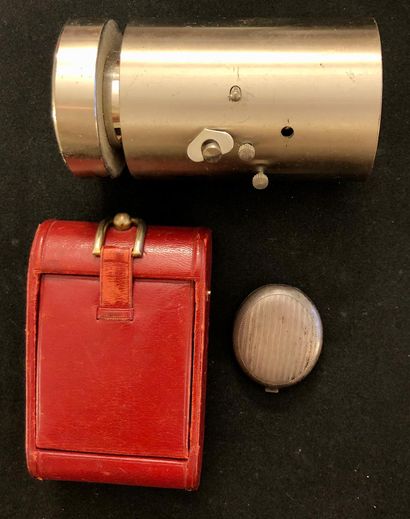 null A leather folding 'Jaz' alarm clock; a steel 'Uti design' alarm clock in cylindrical...