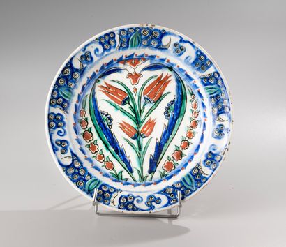 null IZNIK

Round siliceous ceramic dish with lead glaze

with polychrome decoration...