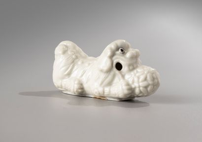 null CHINA, Kangxi period, 18th century

China white porcelain brush rest,

representing...