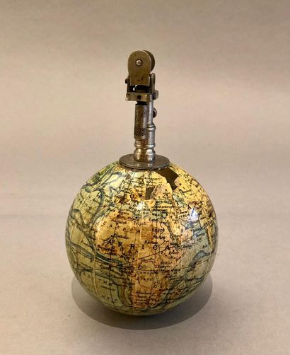 null Small weighted globe, carrying a lighter, for the English market. The globe...