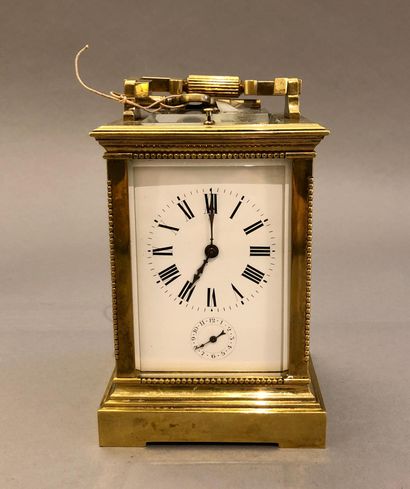 A very solid ormolu travel clock with a large...