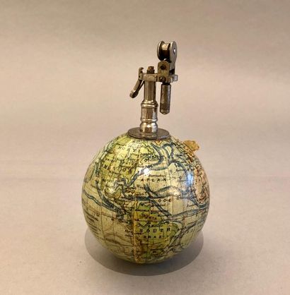 null Small weighted globe, carrying a lighter, for the English market. The globe...