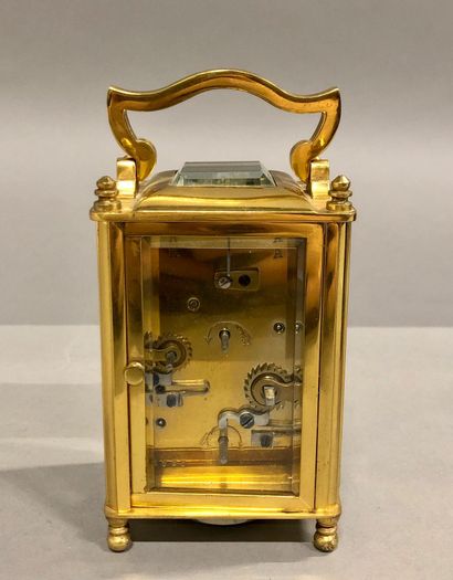 null Travelling alarm clock with anchor escapement signed 'Paul Garnier'. Height...