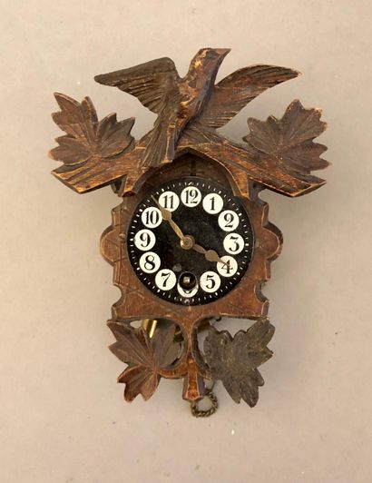 A miniature cuckoo clock. Wood and brass....