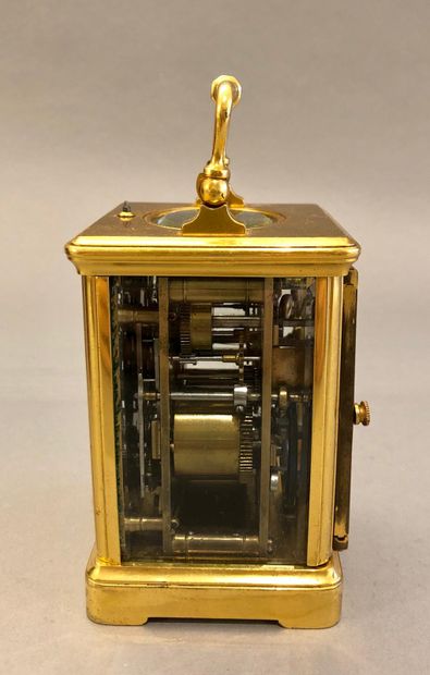 null Travelling alarm clock with dial (cracks) embedded in the gilt plate, missing...