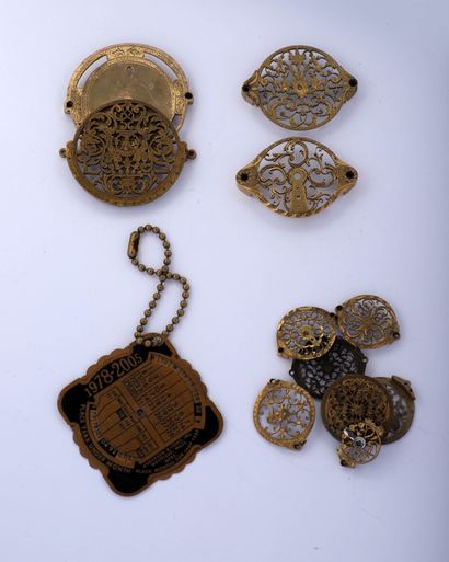 null Eleven gilded, openwork and engraved brass watch cocks from the 18th century...
