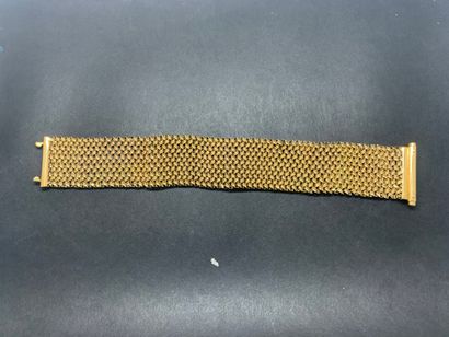 null Bracelet manchette en or jaune 18K 750°/°° étranger à motifs de maillons tressés

L....