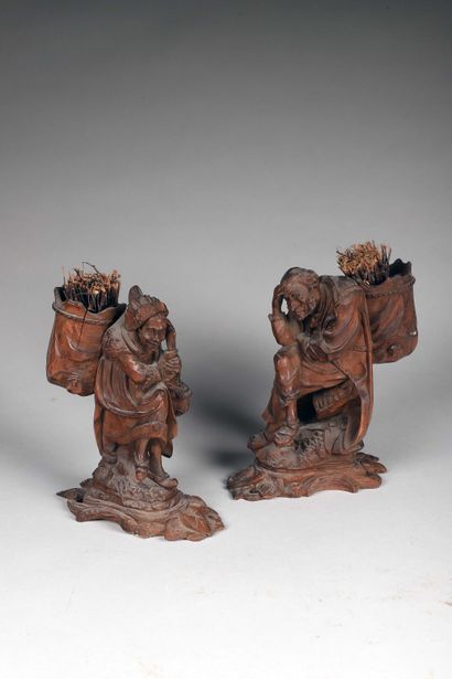 null Deux statuettes en pendant en bois léger très finement sculpté

Les marchands...