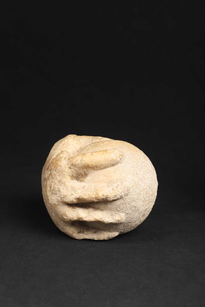 null Fragment of a statue representing the right hand of a child clutching a ball...