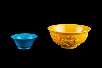 null Two glass cups, one in imitation of turquoise, the other yellow with birds among...