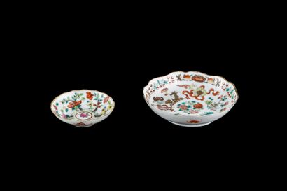 null Two porcelain and enamels of the pink family, decorated with floral compositions....