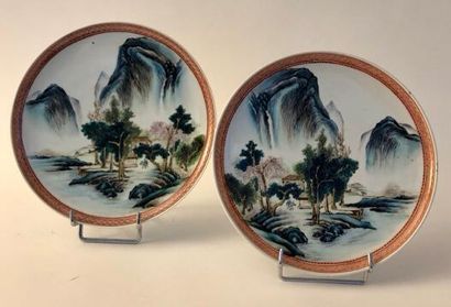 Pair of porcelain and enamel plates decorated...