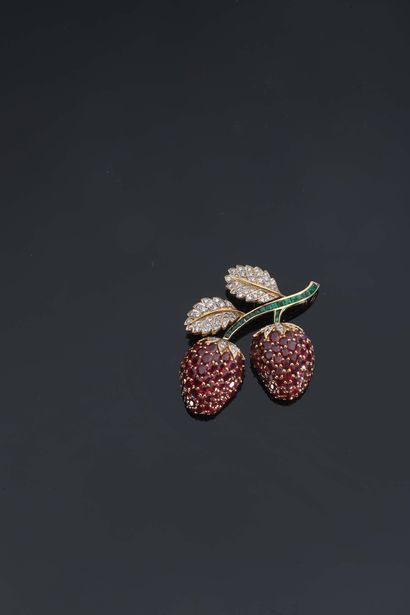 A brooch pendant featuring a branch of strawberry...