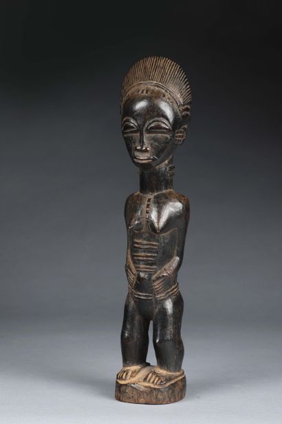 null Statue Baoulé, Côte d’Ivoire
Bois dur à patine brun noir
H. 31,5 cm

Statue...