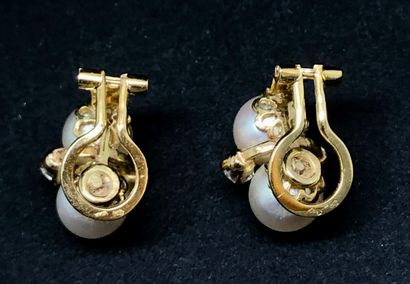 null Pair of yellow gold ear clips each adorned with two cultured pearls between...