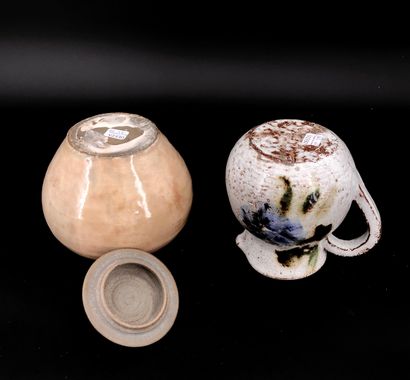 null Two stonewares, including a covered globular beige glazed pot and a jug with...