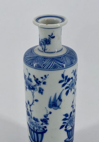 null White porcelain scroll vase with blue underglaze decoration of flowering planters,...