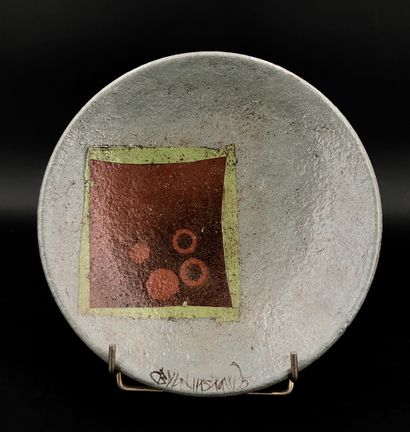 null Ceramic/earthenware circular bowl with brown and green geometric decoration.
Unidentified...