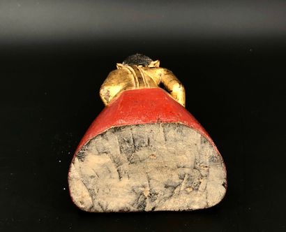 null Small Buddha in gold and red lacquered wood, sitting in meditation, taking the...