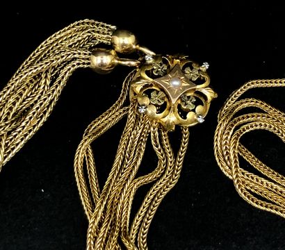 null Long necklace with several rows of yellow gold braided decorated with a flowing.
Work...