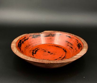null Turned wooden bowl, with flat bottom and flared wall, the interior lacquered...