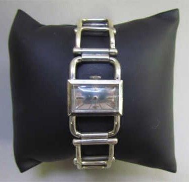 JAEGER-LECOULTRE, circa 1960 MONTRE "Etrier" en acier, bracelet articulé en argent...