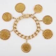 null Bracelet gourmette en or jaune 18K à breloques en forme de pièces de monnaies...
