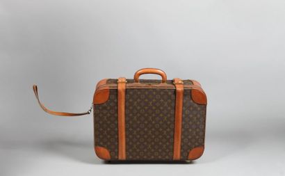 LOUIS VUITTON VALISE à roulettes semi rigide en toile Monogram et cuir naturel, poignée,...