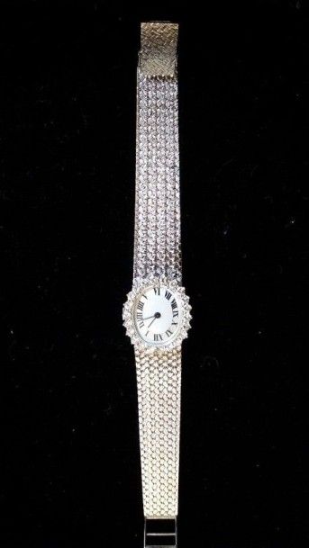 null Montre-bracelet de femme en or blanc 18K (750°/°°), le cadran ovale serti de...