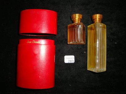 Jean Dessés «Celui De» Elégant étui de voyage en cuir rouge contenant deux flacons...